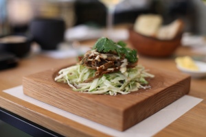 Slow roasted shredded duck on a bed of cucumber and sultana salad